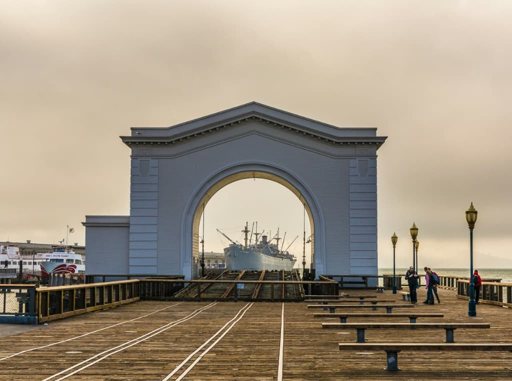 Pier with a ship in the distance